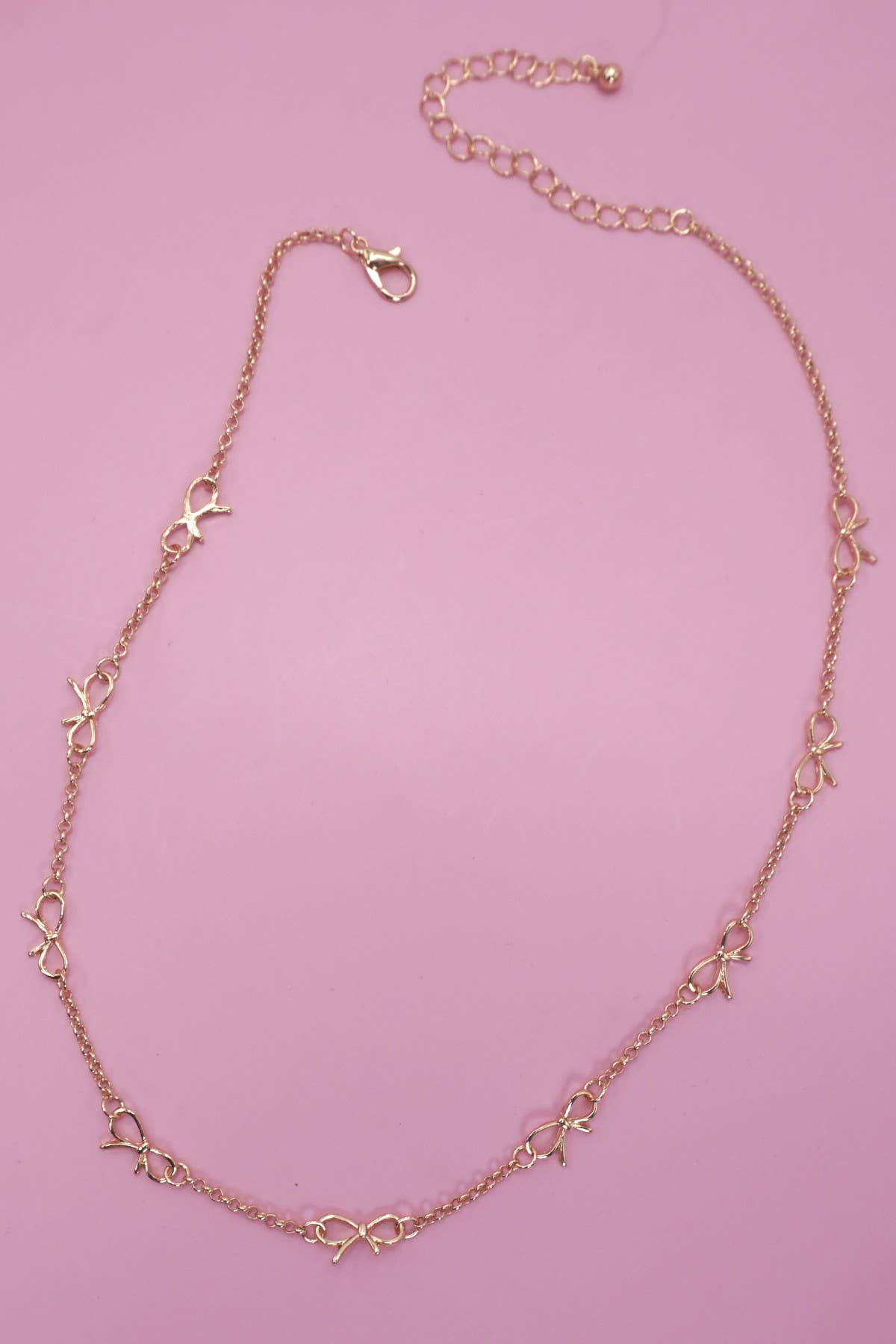 CUTOUT BOW STATION NECKLACE | 80N91531: Gold