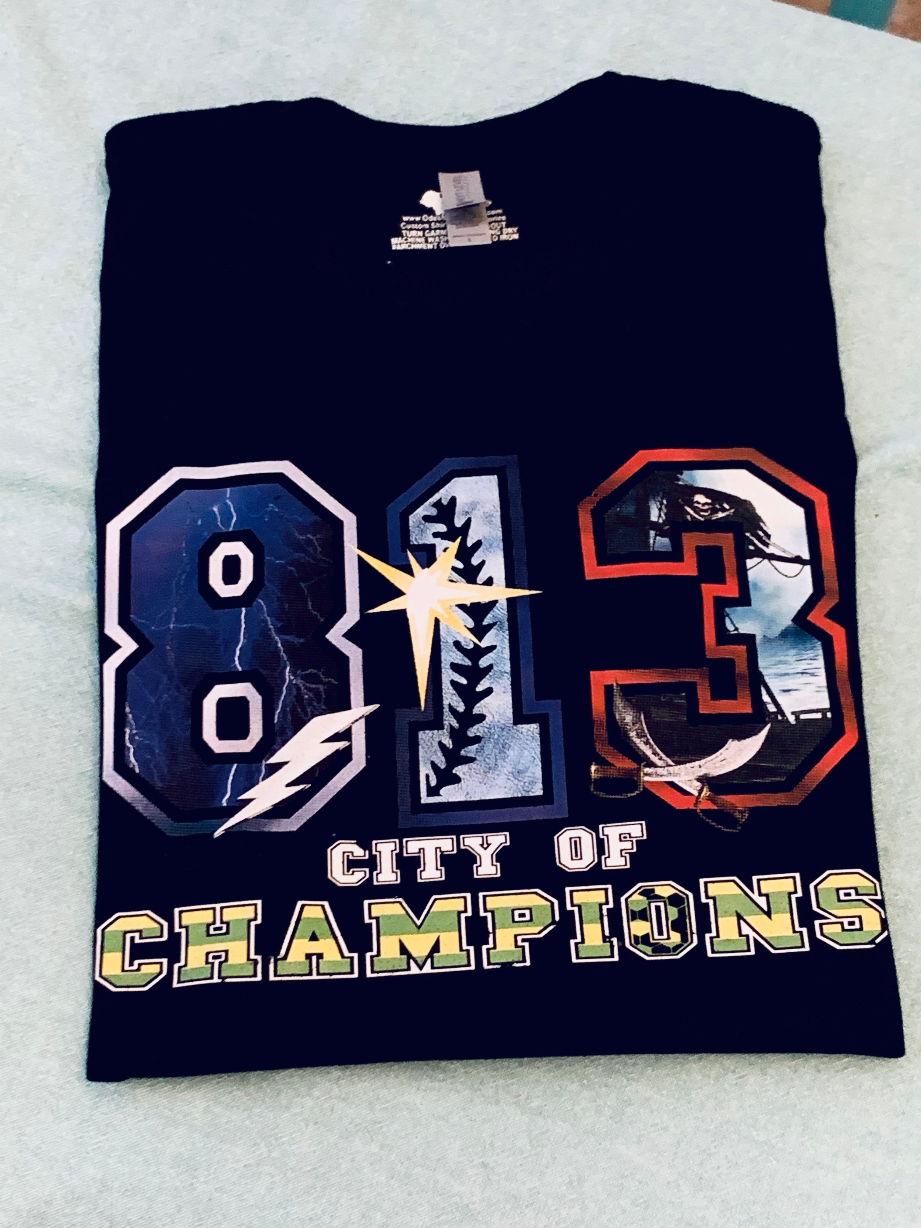 Tampa Bay Rays Tampa Bay Lightning and Tampa Bay Buccaneers 813 city of  champions shirt, hoodie, sweater, long sleeve and tank top